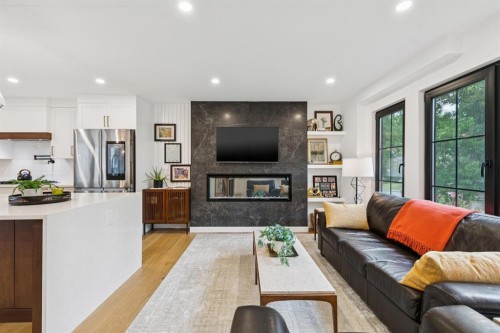 2543 Chicoutimi Drive Nw, Calgary, AB - Indoor Photo Showing Living Room With Fireplace