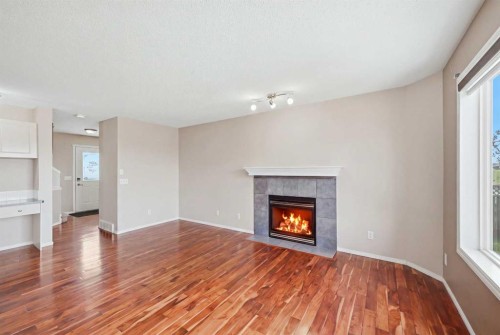 86 Saddlecrest Close Ne, Calgary, AB - Indoor Photo Showing Living Room With Fireplace