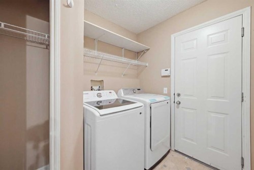 86 Saddlecrest Close Ne, Calgary, AB - Indoor Photo Showing Laundry Room