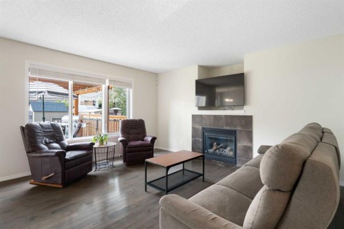 818 Copperfield Boulevard Se, Calgary, AB - Indoor Photo Showing Living Room With Fireplace