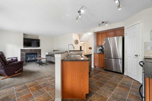 818 Copperfield Boulevard Se, Calgary, AB - Indoor Photo Showing Kitchen With Fireplace