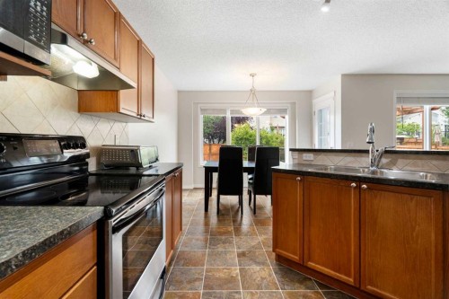 818 Copperfield Boulevard Se, Calgary, AB - Indoor Photo Showing Kitchen With Double Sink