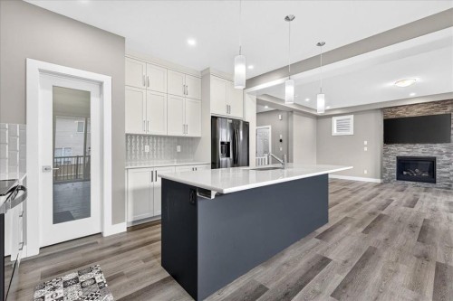 244 Carrington Crescent Nw, Calgary, AB - Indoor Photo Showing Kitchen With Fireplace With Upgraded Kitchen