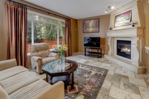 66 Copperfield Close Se, Calgary, AB - Indoor Photo Showing Living Room With Fireplace