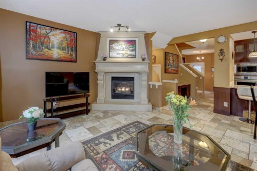 66 Copperfield Close Se, Calgary, AB - Indoor Photo Showing Living Room With Fireplace