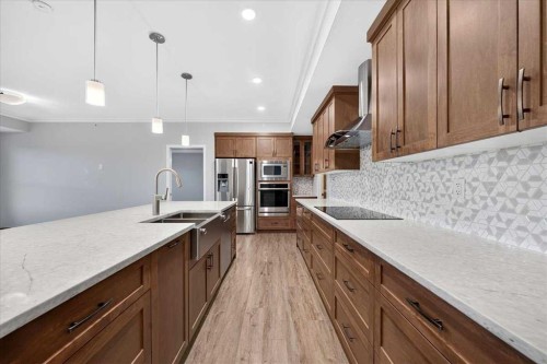 406-4350 Seton Drive Se, Calgary, AB - Indoor Photo Showing Kitchen With Stainless Steel Kitchen With Double Sink With Upgraded Kitchen