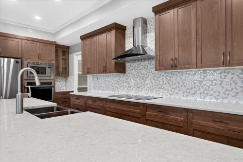 406-4350 Seton Drive Se, Calgary, AB - Indoor Photo Showing Kitchen With Stainless Steel Kitchen With Upgraded Kitchen