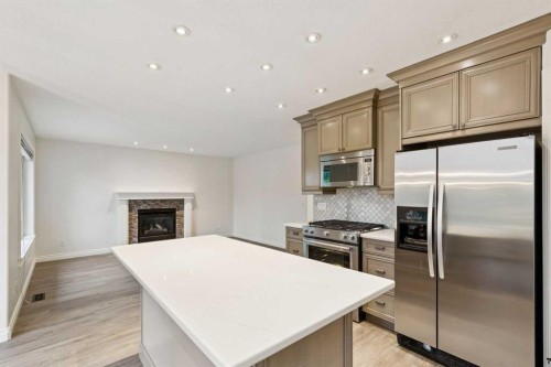 38 Tuscany Hills Crescent Nw, Calgary, AB - Indoor Photo Showing Kitchen With Upgraded Kitchen
