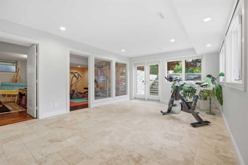 109 Shawnee Place Sw, Calgary, AB - Indoor Photo Showing Gym Room