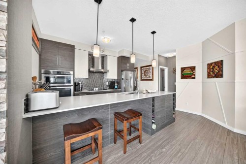 201-122 Mahogany Centre Se, Calgary, AB - Indoor Photo Showing Kitchen With Upgraded Kitchen