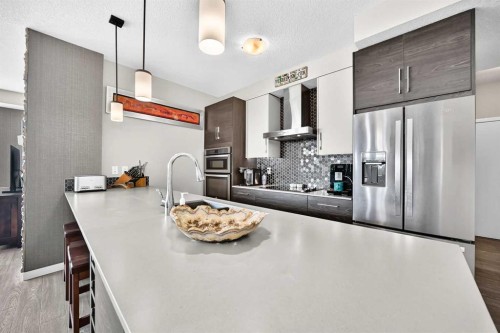 201-122 Mahogany Centre Se, Calgary, AB - Indoor Photo Showing Kitchen With Stainless Steel Kitchen With Upgraded Kitchen