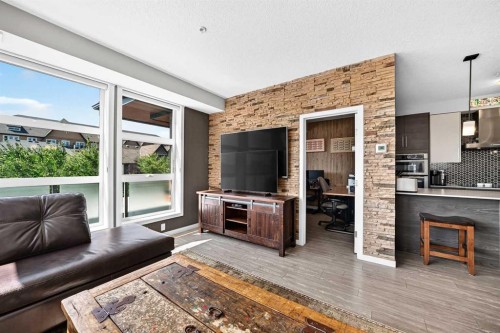 201-122 Mahogany Centre Se, Calgary, AB - Indoor Photo Showing Living Room