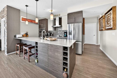 201-122 Mahogany Centre Se, Calgary, AB - Indoor Photo Showing Kitchen With Upgraded Kitchen