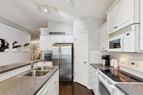 21 Covehaven Gardens Ne, Calgary, AB - Indoor Photo Showing Kitchen With Double Sink