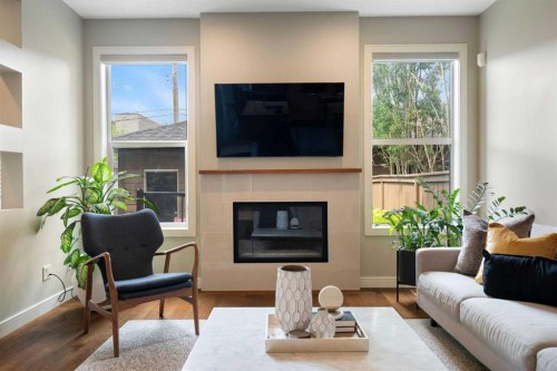3213 Kinsale Road Sw, Calgary, AB - Indoor Photo Showing Living Room With Fireplace