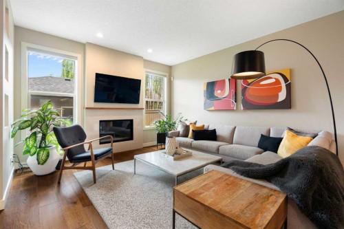 3213 Kinsale Road Sw, Calgary, AB - Indoor Photo Showing Living Room With Fireplace