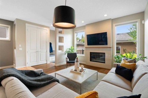 3213 Kinsale Road Sw, Calgary, AB - Indoor Photo Showing Living Room With Fireplace
