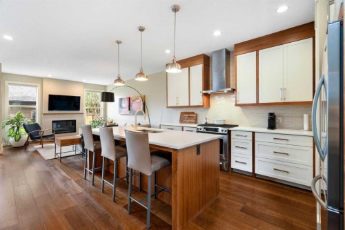 3213 Kinsale Road Sw, Calgary, AB - Indoor Photo Showing Kitchen With Fireplace With Upgraded Kitchen