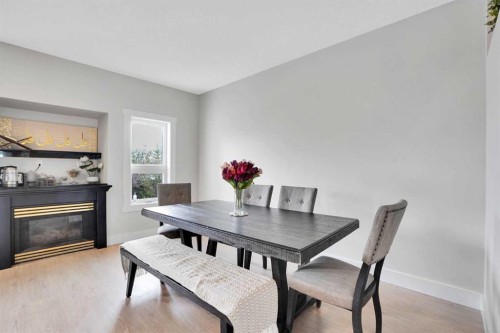227 Citadel Lane Nw, Calgary, AB - Indoor Photo Showing Dining Room With Fireplace