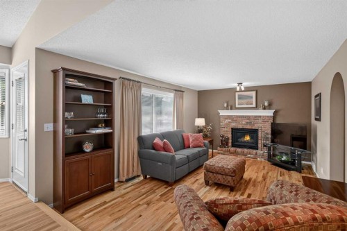 264 Riverview Close Se, Calgary, AB - Indoor Photo Showing Living Room With Fireplace