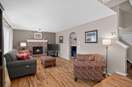 264 Riverview Close Se, Calgary, AB - Indoor Photo Showing Living Room With Fireplace