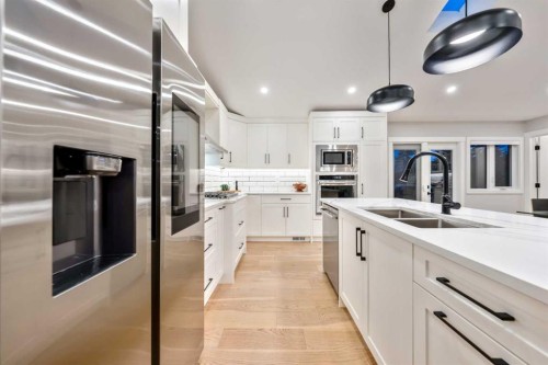 100 Lake Crimson Close Se, Calgary, AB - Indoor Photo Showing Kitchen With Stainless Steel Kitchen With Double Sink With Upgraded Kitchen