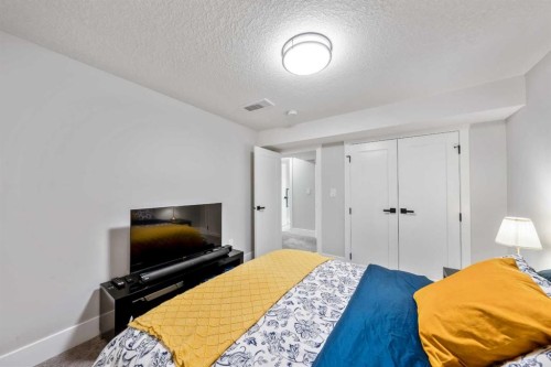 100 Lake Crimson Close Se, Calgary, AB - Indoor Photo Showing Bedroom