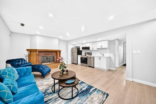 6832 37 Avenue Ne, Calgary, AB - Indoor Photo Showing Living Room With Fireplace