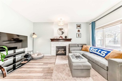 485 Cimarron Boulevard, Okotoks, AB - Indoor Photo Showing Living Room With Fireplace