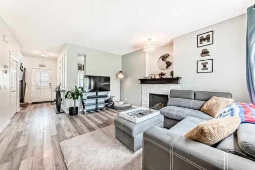 485 Cimarron Boulevard, Okotoks, AB - Indoor Photo Showing Living Room With Fireplace
