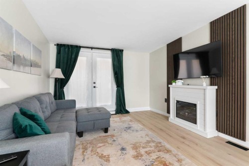 222 45 Avenue West, Claresholm, AB - Indoor Photo Showing Living Room With Fireplace