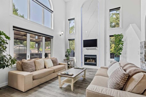 11 Citadel Meadow Grove Nw, Calgary, AB - Indoor Photo Showing Living Room With Fireplace
