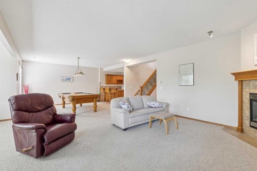 7 Wentworth Landing Sw, Calgary, AB - Indoor Photo Showing Living Room With Fireplace