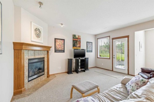 7 Wentworth Landing Sw, Calgary, AB - Indoor Photo Showing Living Room With Fireplace
