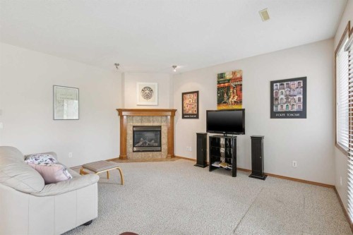7 Wentworth Landing Sw, Calgary, AB - Indoor Photo Showing Living Room With Fireplace