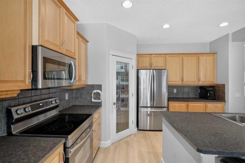 646 Chaparral Drive Se, Calgary, AB - Indoor Photo Showing Kitchen With Double Sink