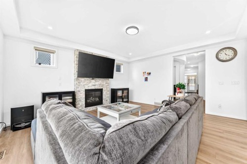 149 Carrington Crescent Nw, Calgary, AB - Indoor Photo Showing Living Room With Fireplace