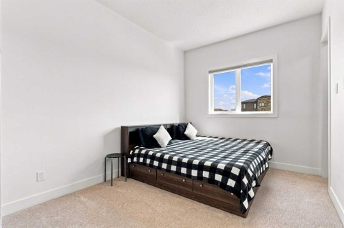 201 Milton Road, Conrich, AB - Indoor Photo Showing Bedroom