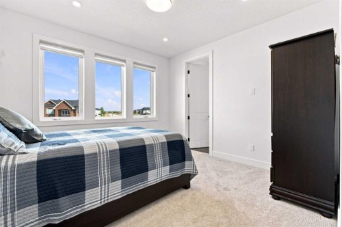 201 Milton Road, Conrich, AB - Indoor Photo Showing Bedroom