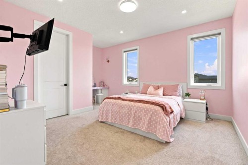 201 Milton Road, Conrich, AB - Indoor Photo Showing Bedroom
