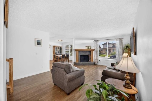 80 Templevale Way Ne, Calgary, AB - Indoor Photo Showing Living Room With Fireplace