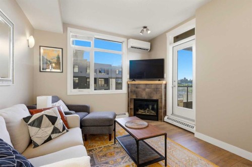 536-990 Centre Avenue Ne, Calgary, AB - Indoor Photo Showing Living Room With Fireplace