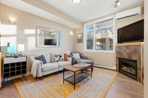 536-990 Centre Avenue Ne, Calgary, AB - Indoor Photo Showing Living Room With Fireplace