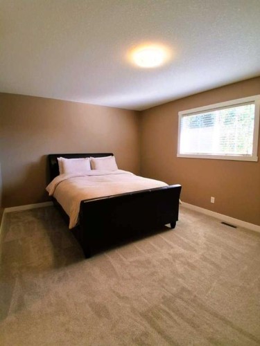 301 Ranch Ridge Meadow, Strathmore, AB - Indoor Photo Showing Bedroom