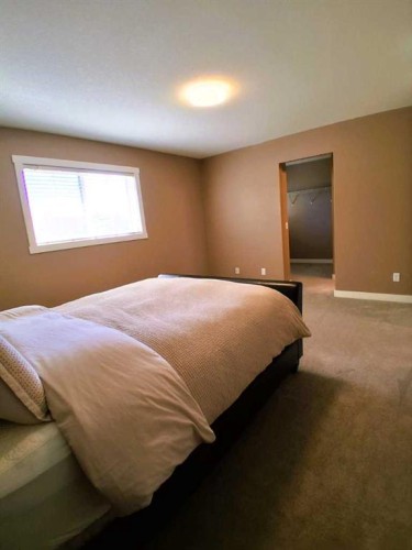 301 Ranch Ridge Meadow, Strathmore, AB - Indoor Photo Showing Bedroom