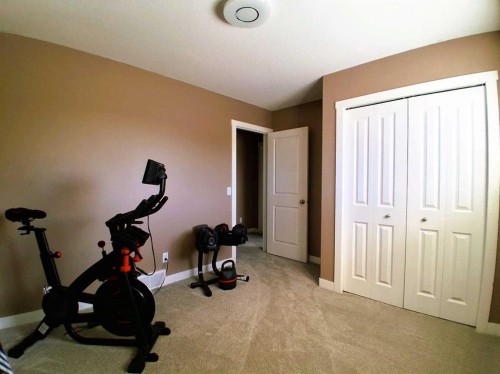 301 Ranch Ridge Meadow, Strathmore, AB - Indoor Photo Showing Gym Room