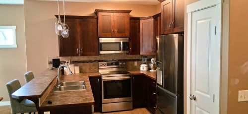 301 Ranch Ridge Meadow, Strathmore, AB - Indoor Photo Showing Kitchen With Double Sink