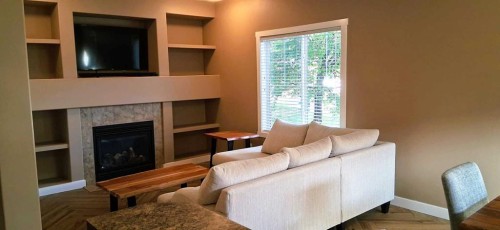 301 Ranch Ridge Meadow, Strathmore, AB - Indoor Photo Showing Living Room With Fireplace