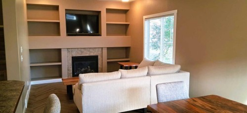 301 Ranch Ridge Meadow, Strathmore, AB - Indoor With Fireplace