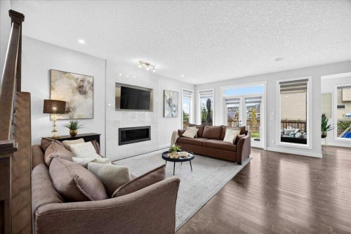 546 Sherwood Boulevard Nw, Calgary, AB - Indoor Photo Showing Living Room With Fireplace